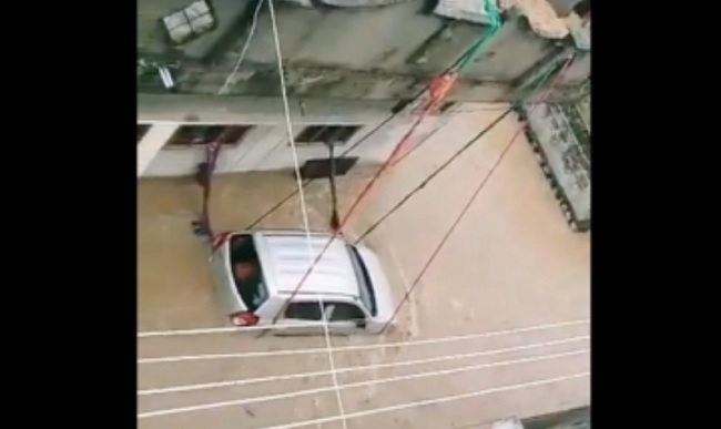 Man ties car with ropes in flood-hit Telangana town