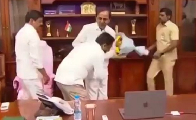 Telangana official triggers row by touching CM's feet