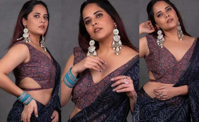 Pics: Anasuya's Feminine Glory In Saree