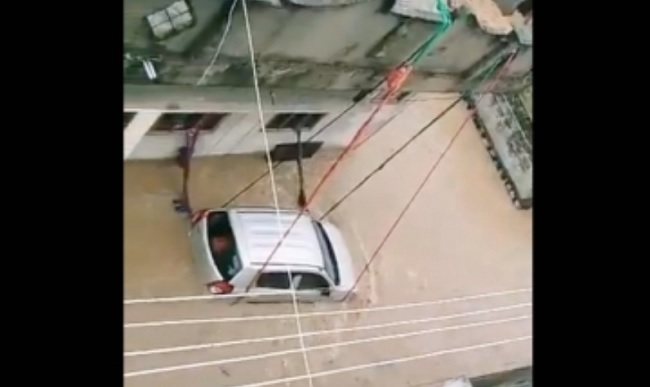 Man ties car with ropes in flood-hit Telangana town