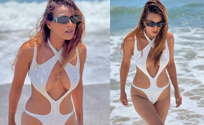 Pics: Actress oozes oomph in white cut-out bikini