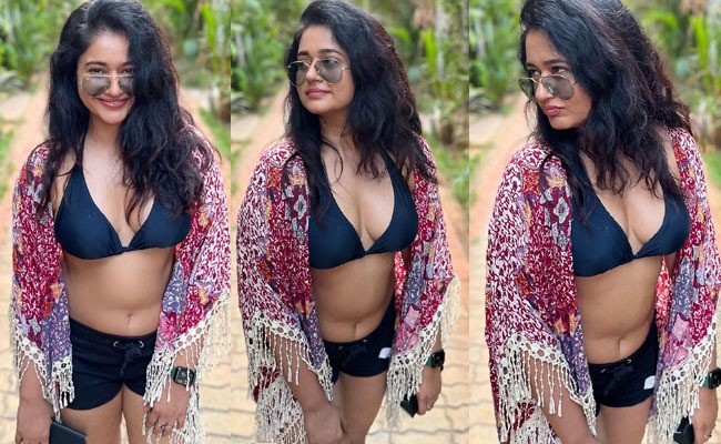 Pics: Poonam Smiles While Wearing a Bra and Shorts
