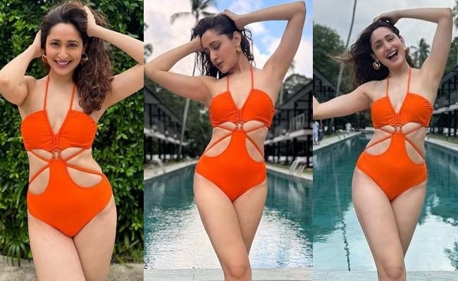 Pics: Sensuous Lady With Saffron Swimsuit