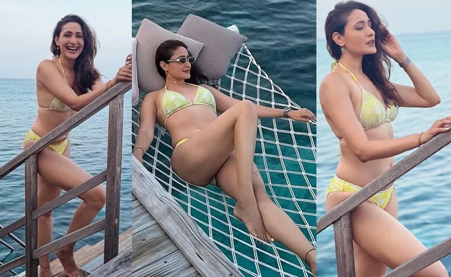HOT: Tall Actress Stuns In Bold Green Bikini