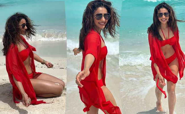 Pics: Tall Lady Entices In Red Swim Suit