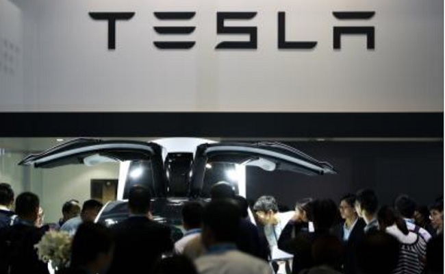 Tesla again cuts EV prices in US