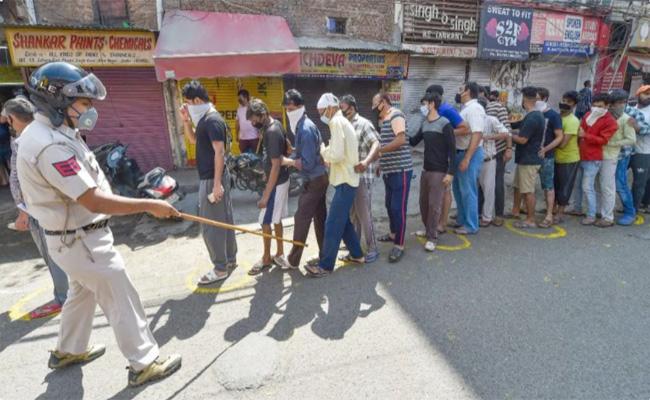 Long queues as Telangana re-opens liquor shops