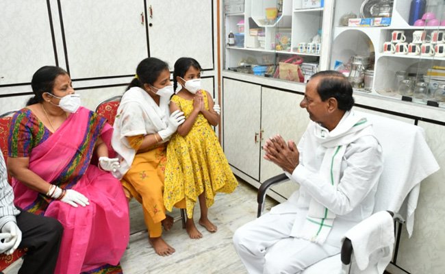 KCR hands over cheques, job letter to martyred Colonel's kin