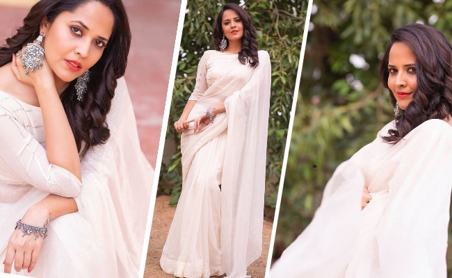 Pics: Anasuya's Sculpted Figure In White Saree