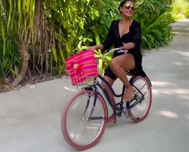 Actress Goes Cycling In Black Bikini